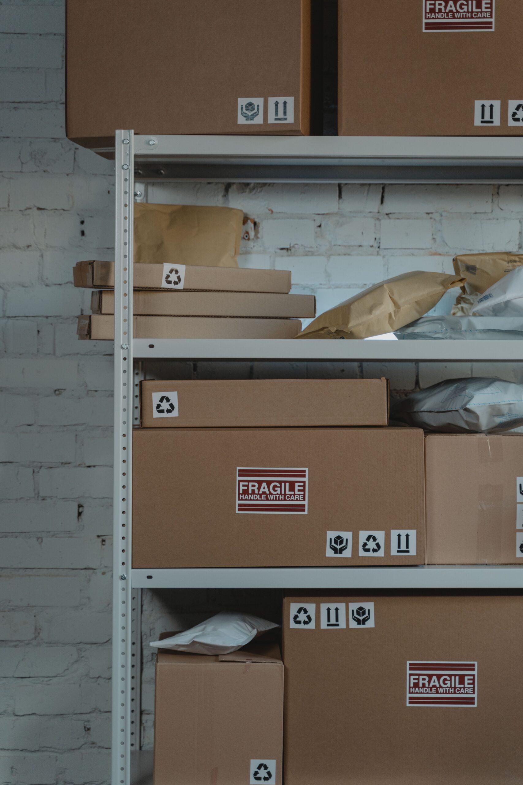 Organized cardboard boxes labeled 'Fragile' in warehouse setting for shipping and logistics.